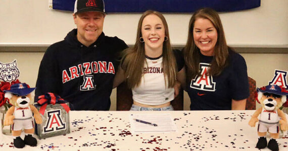 Mead Family courtesy photo
Kingston senior Delaney Mead, middle, signed her letter of intent to attend the University of Arizona Nov. 13 at Kingston High School. Joining her was dad Cory and mom Shannon.