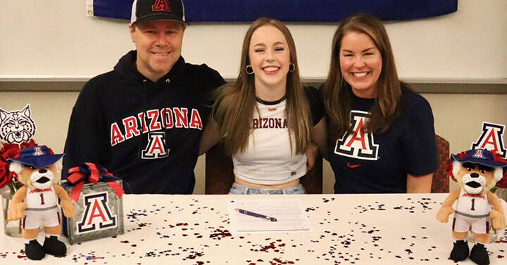 Mead Family courtesy photo
Kingston senior Delaney Mead, middle, signed her letter of intent to attend the University of Arizona Nov. 13 at Kingston High School. Joining her was dad Cory and mom Shannon.