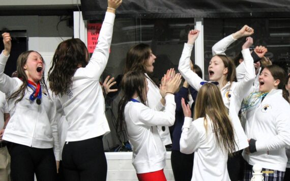 Elisha Meyer/Kitsap News Group photos
 Bainbridge swimmers rejoice after officials announce the Spartans won their first WIAA state championship since 2021.