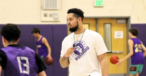 Elisha Meyer/Kitsap News Group 
NK coach Shaa Humphrey runs his players through conditioning at the start of practice.