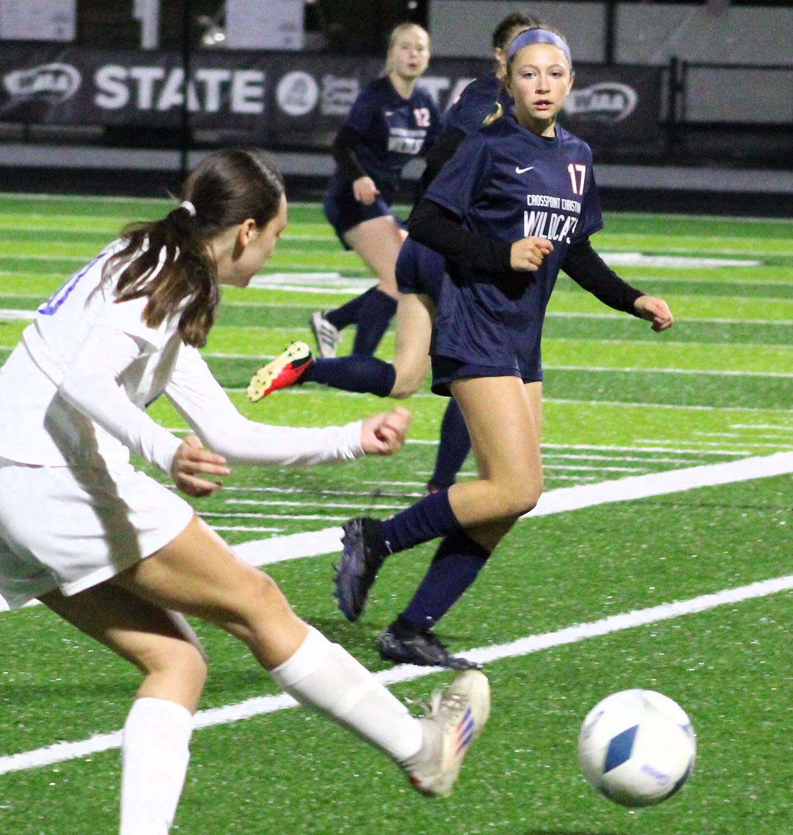 Elisha Meyer/Kitsap News Group
Crosspoint eighth-grader Rylie Phillips tracks a ball kicked by Mount Vernon in the first half of a state semifinal contest.