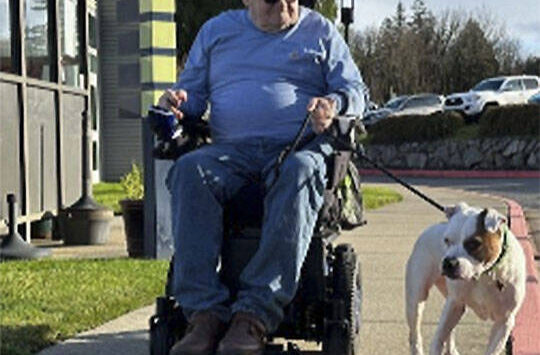 Mike De Felice/Kitsap News Group photos
Glenn Baker is responsible for taking Meatball on her morning walks around the grounds of the Washington Veterans Home - Retsil in Port Orchard.