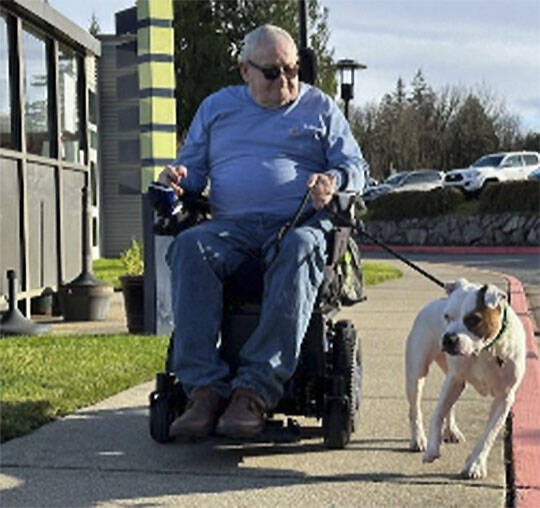 Mike De Felice/Kitsap News Group photos
Glenn Baker is responsible for taking Meatball on her morning walks around the grounds of the Washington Veterans Home - Retsil in Port Orchard.