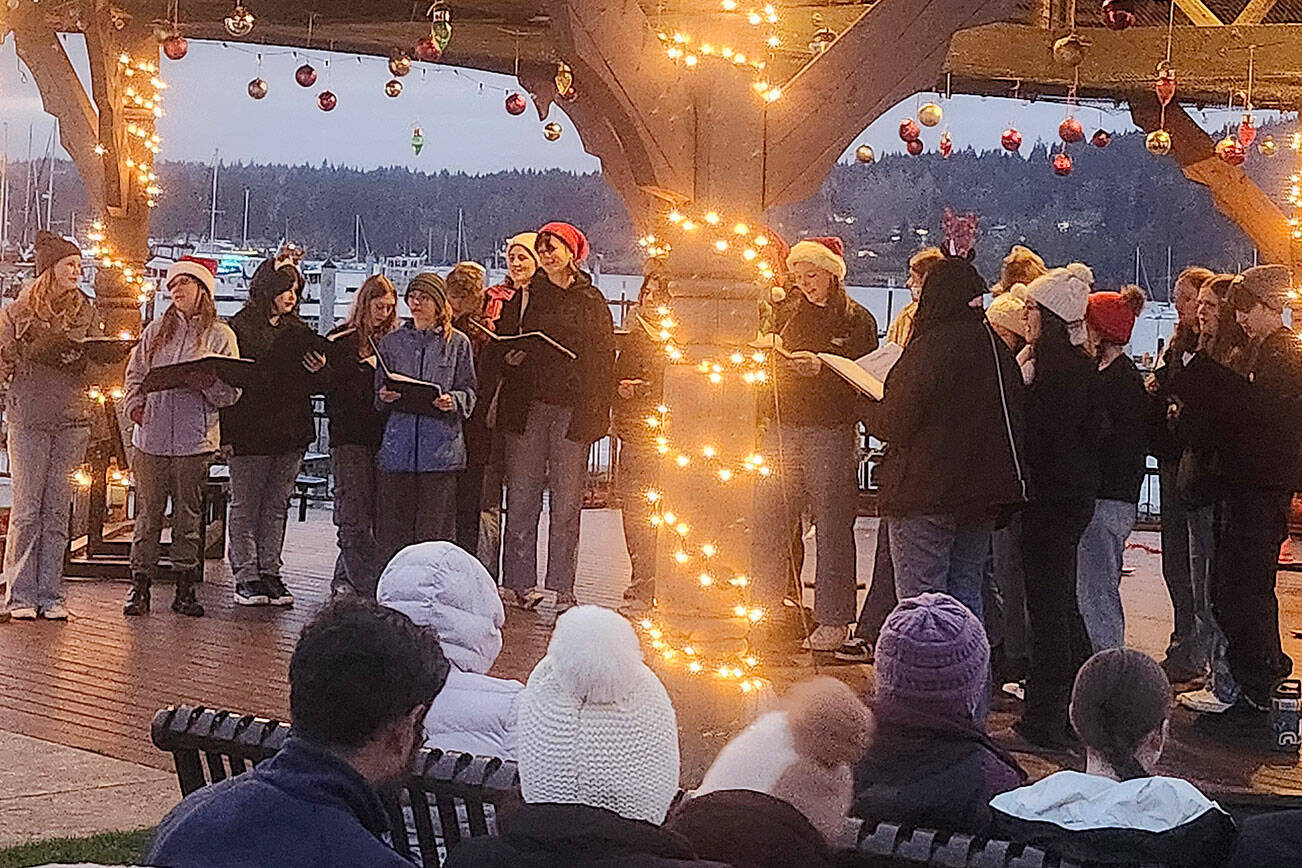 Tyler Shuey/Kitsap News Group photos
The North Kitsap High School choir gets the festivities started with some Christmas carols.