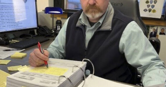 Mike De Felice/Kitsap News Group
Sgt. Jason Vertefeuille of the Bremerton Police Department pours over reports of stolen vehicles in Kitsap County and looks for trends. His work has dramatically reduced the number of such thefts.