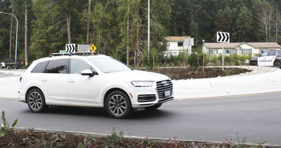 Molly Hetherwick/Kitsap News Group photos
Cars pass through the new roundabout at the intersection of West Port Madison Road and Highway 305.