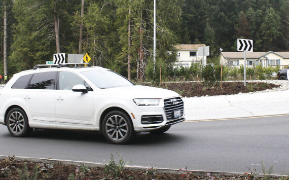 Molly Hetherwick/Kitsap News Group photos
Cars pass through the new roundabout at the intersection of West Port Madison Road and Highway 305.