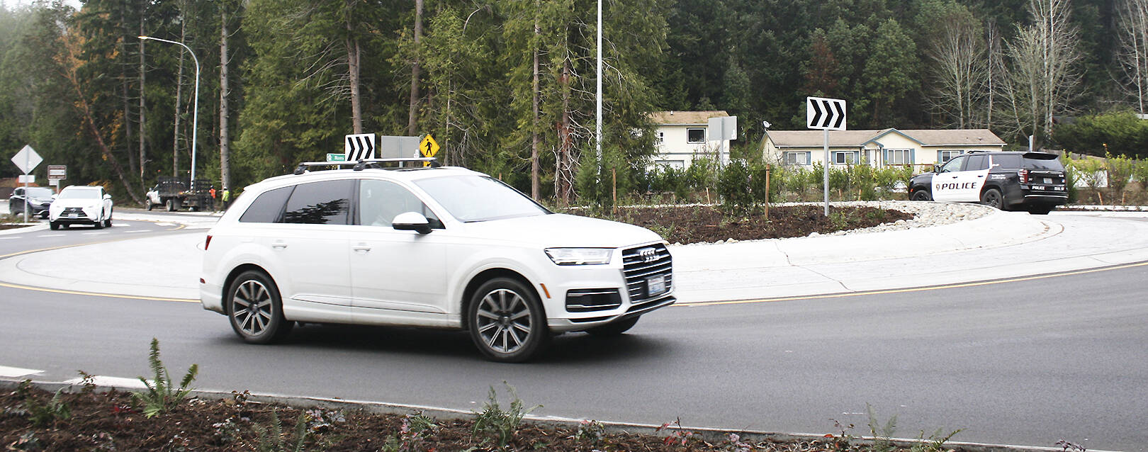 Molly Hetherwick/Kitsap News Group photos
Cars pass through the new roundabout at the intersection of West Port Madison Road and Highway 305.