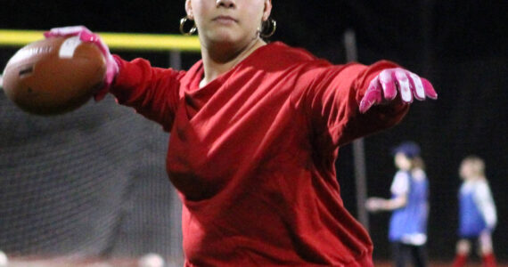 Elisha Meyer/Kitsap News Group photos
Kingston senior Joey Castillo warms up her arm before an evening flag football practice.