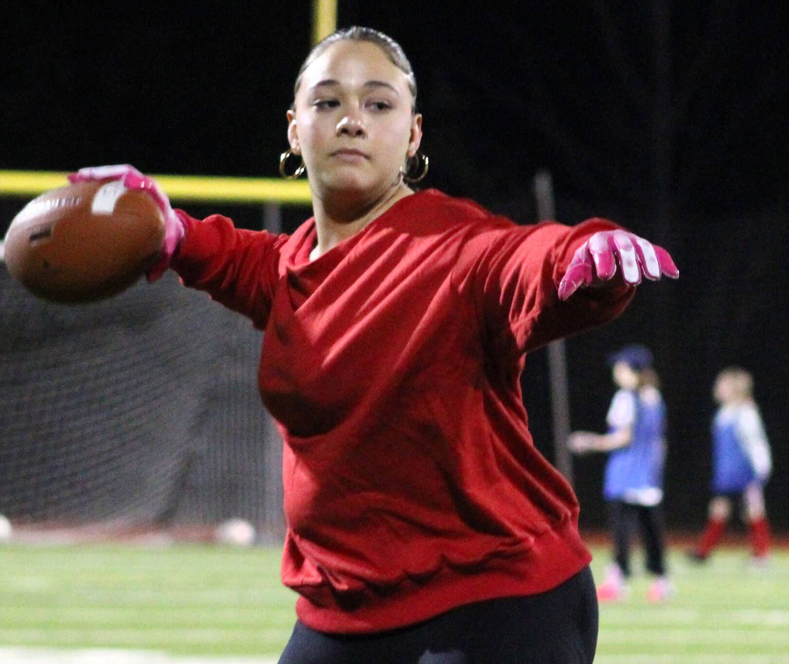 Elisha Meyer/Kitsap News Group photos
Kingston senior Joey Castillo warms up her arm before an evening flag football practice.