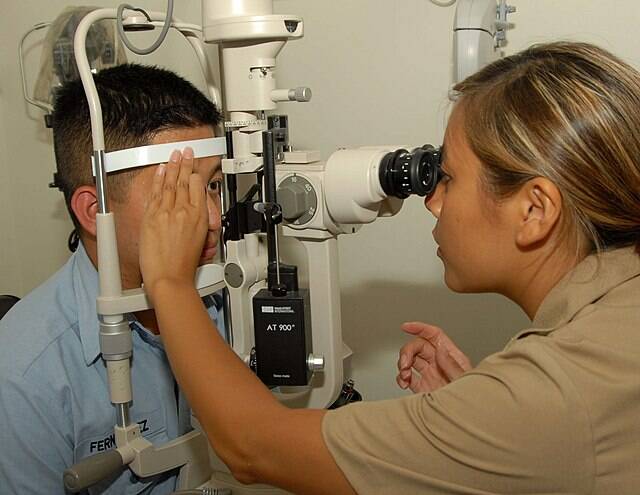 US Navy courtesy photo
A Navy optometrist administers a slit lamp eye exam, a routine procedure that is difficult to obtain for United members in Kitsap County.