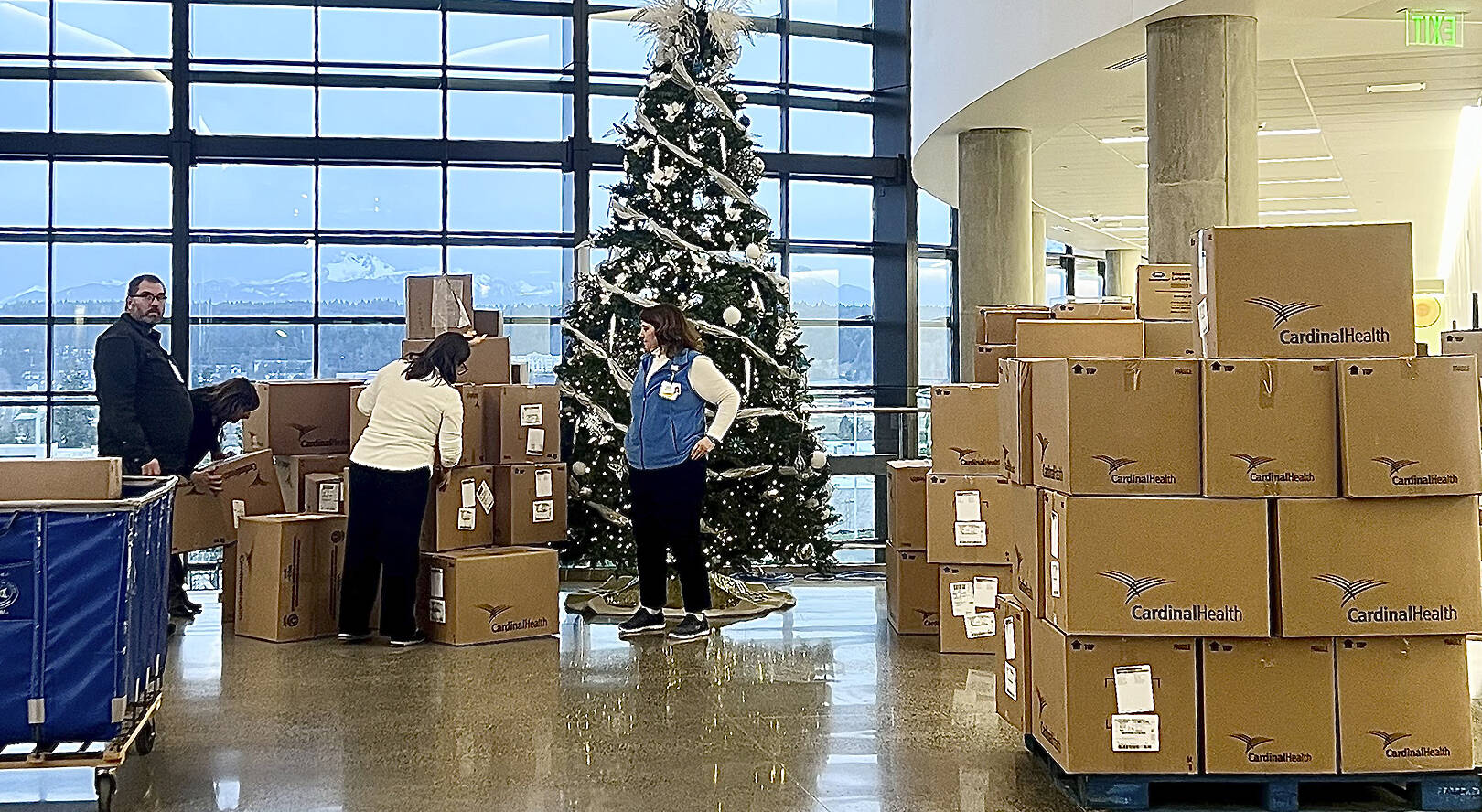 Britney Fletcher-West/Kitsap News Group photos
Volunteers stack boxes of donated toys to be given out at a local hospital.