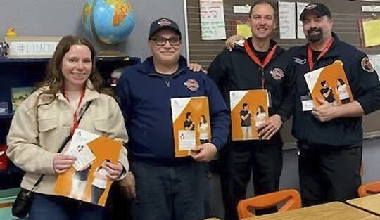 SKFR courtesy photo
South Kitsap Fire & Rescue is one of the program’s newest partners, contributing volunteer mentors to assist in reading sessions.