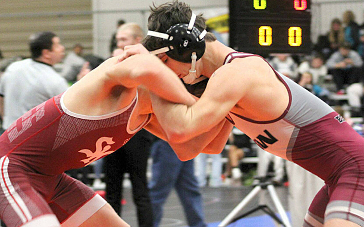 File photo
SK’s Caleb Strobel Fox, left, beat Eli Calderon of Curtis in a matchup Jan. 8 in Port Orchard.